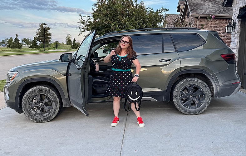 Natalie Merola Standing With The Vw Atlas Peak Edition