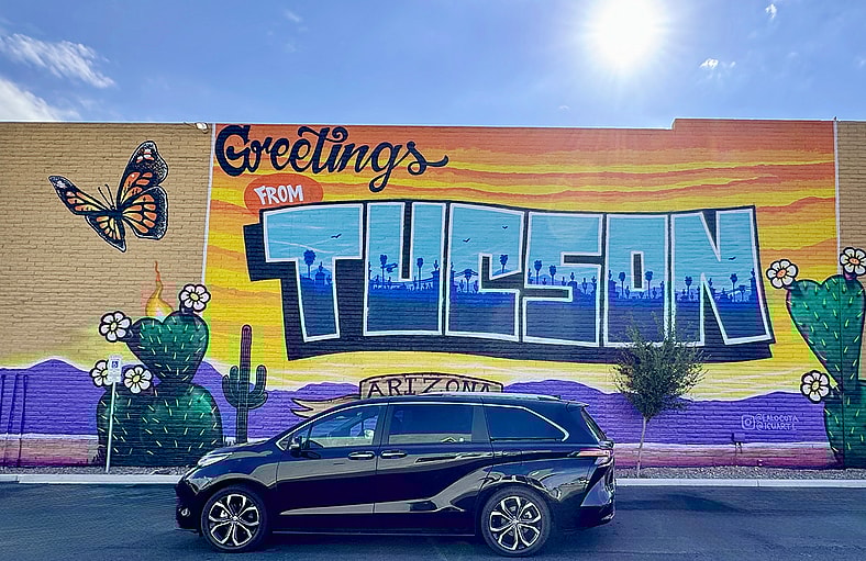 The 2025 Toyota Sienna Platinum Awd Hybrid Against A Beautiful Mural