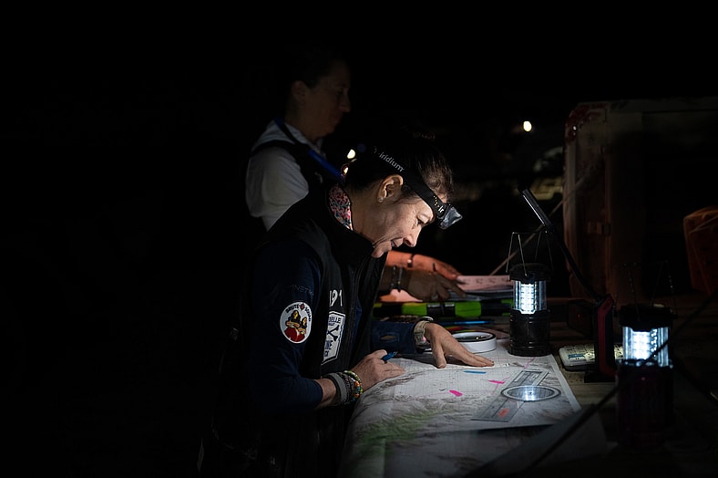 Jill Ciminillo Looking At A Map In The Dark During The 2024 Rebelle Rally