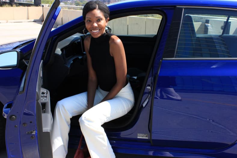 Corliss Sitting In The Driver'S Seat Of The 2025 Vw Golf R 2.0T
