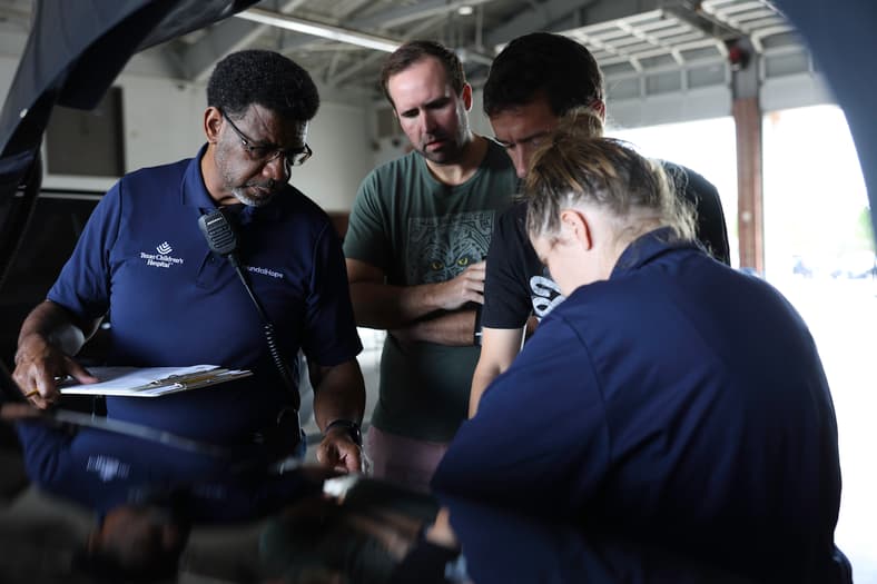 This Huge Car Company Gives To Kids and Communities, From Car Seats to Cancer Research 6 A Young Father And The Baby'S Grandfather Learning How To Secure A Child In A Car Seat