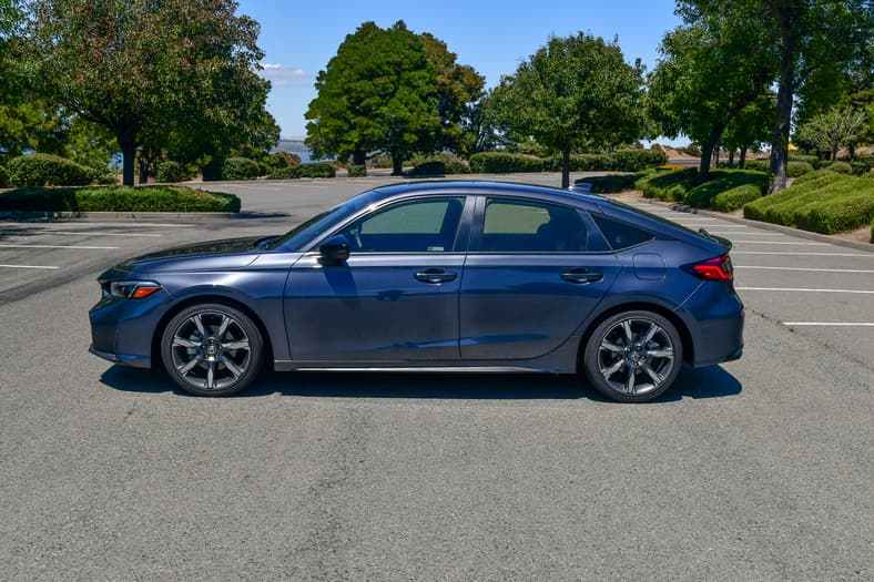 The Side Profile Of The 2026 Honda Civic Hatchback Sport Touring Hybrid