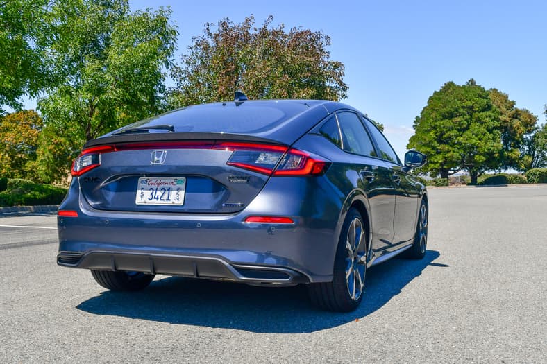 The Rear Quarter End Of The 2026 Honda Civic Hatchback Sport Touring Hybrid