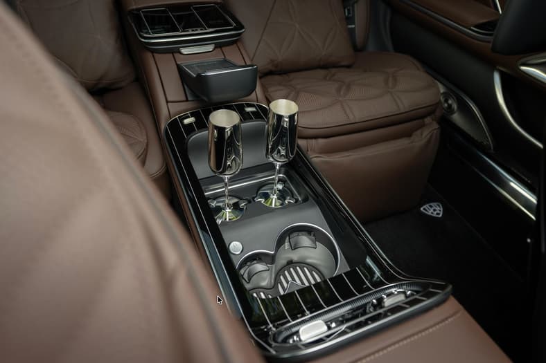 The Executive Package Includes A Refrigerator Between The Rear Seats, Flute Holders That Cleverly Grasp The Flutes And Cup A Holder Large Enough To Hold A Champagne Bottle; Sterling Silver Champagne Flutes Can Be Added