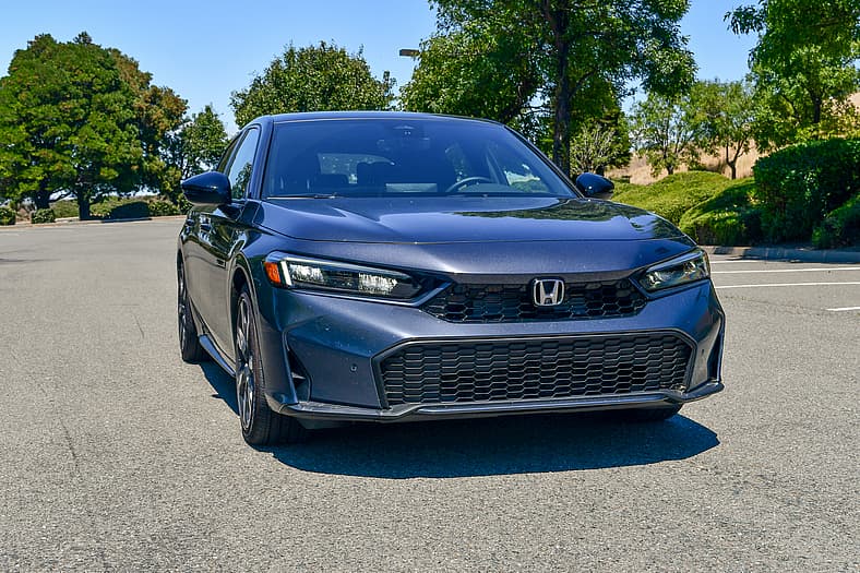 Buy This, Not That: In the Sedan vs. SUV Battle, These 8 Sedans are Family-Friendly, Less Pricey SIV Alternatives 2 The Front End Of The 2026 Honda Civic Hatchback Hybrid Makes A Strong Argument In The Sedan Vs Suv Debate