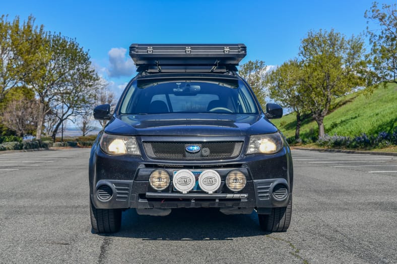 The Very Front End Of My Subaru Forester With A Rooftop Tent