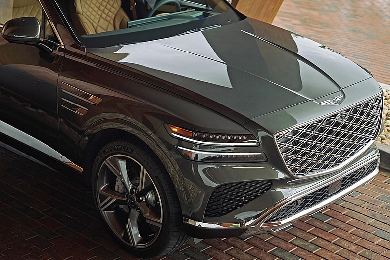 2025 Genesis GV80 First Drive: Being an Honored Guest Elevates the Luxury of This SUV 5 Distinctive Detail Of Mla Headlamps Against New Storr Green Glossy Finish