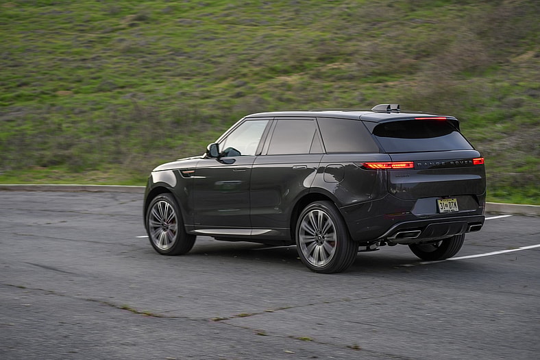 A Rolling Shot Of The Rear Of The 2025 Land Rover Range Rover Sport Autobiography Phev