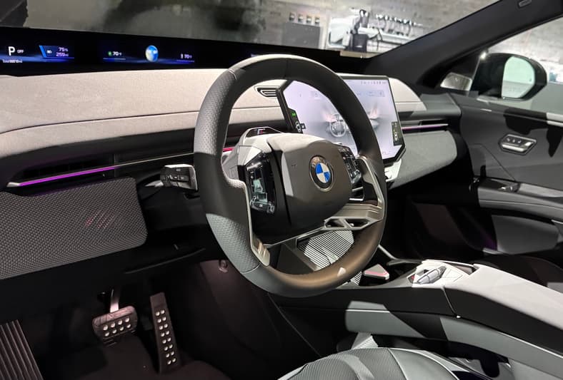 The Front Cabin Of The Bmw Ix3 Features A Panoramic Screen And A New Steering Wheel