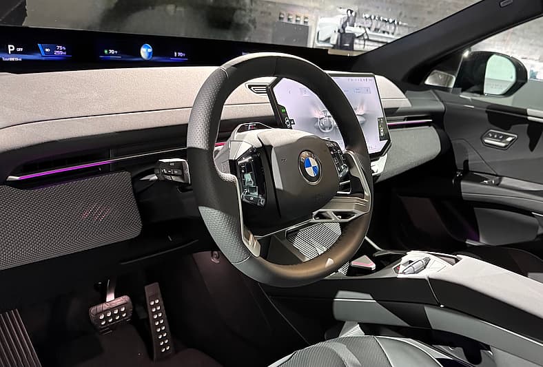 The Front Cabin Of The Bmw Ix3 Features A Panoramic Screen And A New Steering Wheel