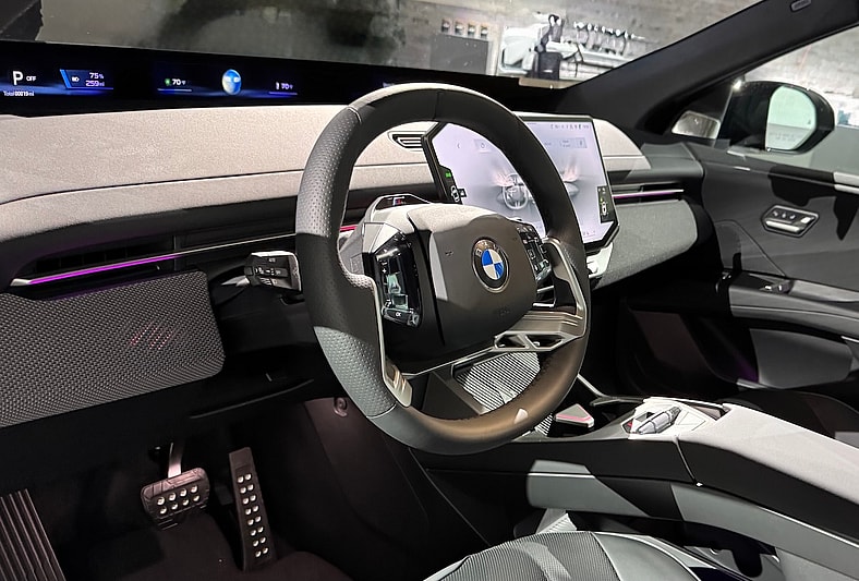 The New BMW X3 is All Electric and It Will Blow You Away: 2026 BMW iX3 First Look 7 The Front Cabin Of The Bmw Ix3 Features A Panoramic Screen And A New Steering Wheel