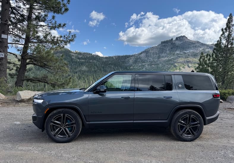 A Side View Of The Rivian R1S Quad