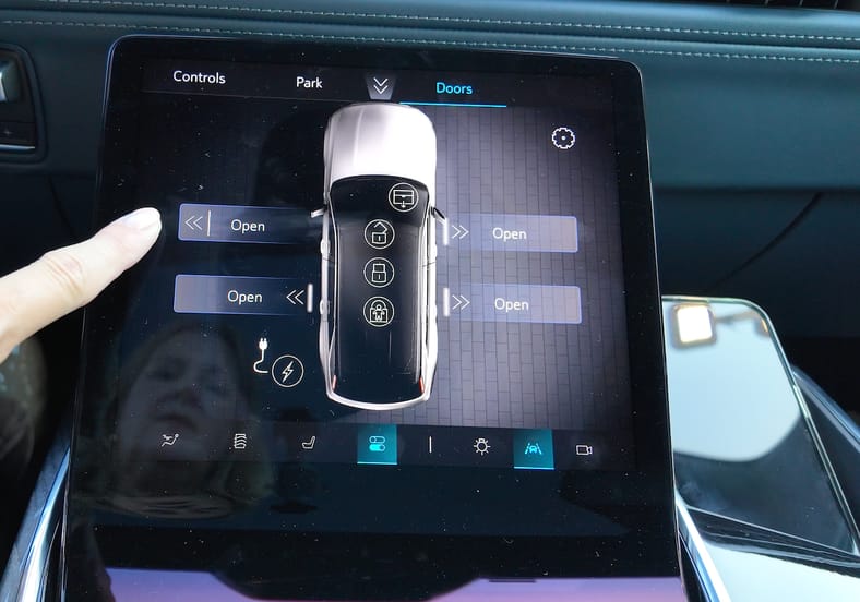 Buttons On The Command Screen In The Cadillac Escalade Iq Will Open Or Close The Doors For You