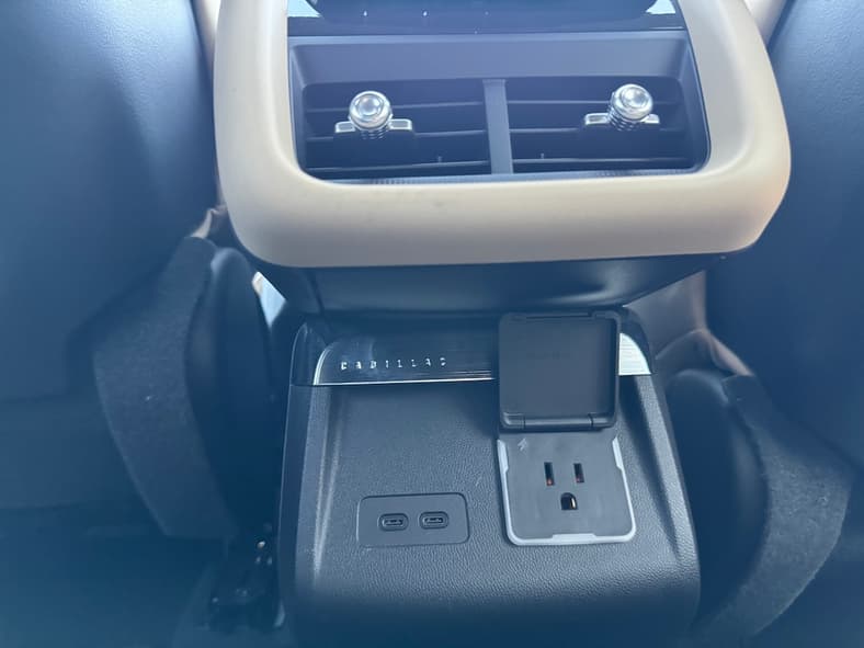 The Rear Seat Includes A Household Outlet And Dual Usb Chargers