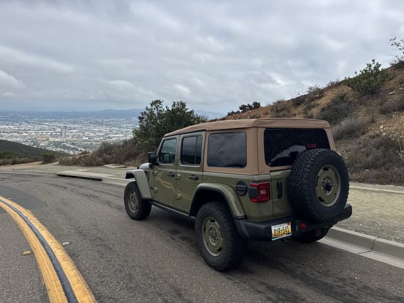 The Rear Quarter Of The 2025 Jeep Wrangler 4Xe Willys In Front Of A Vista