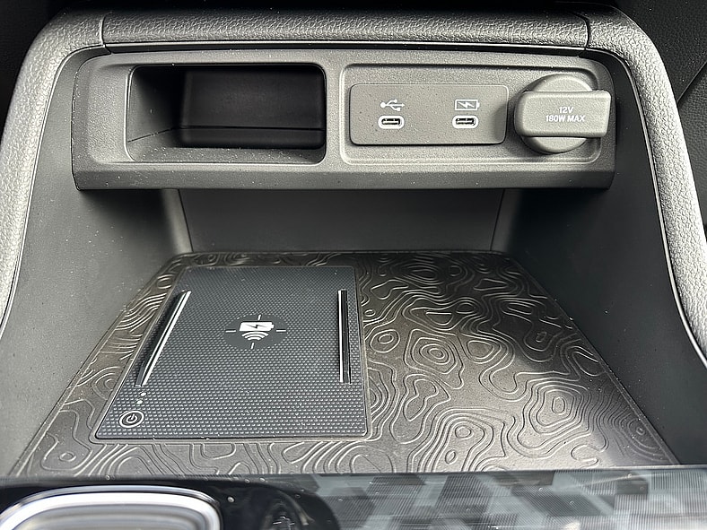 Falling for the 2026 Honda Passport's Classic Looks? Go For TrailSport's Muscle and Class 9 The Newly Redesigned Phone And Charge Cubby In The 2026 Honda Passport