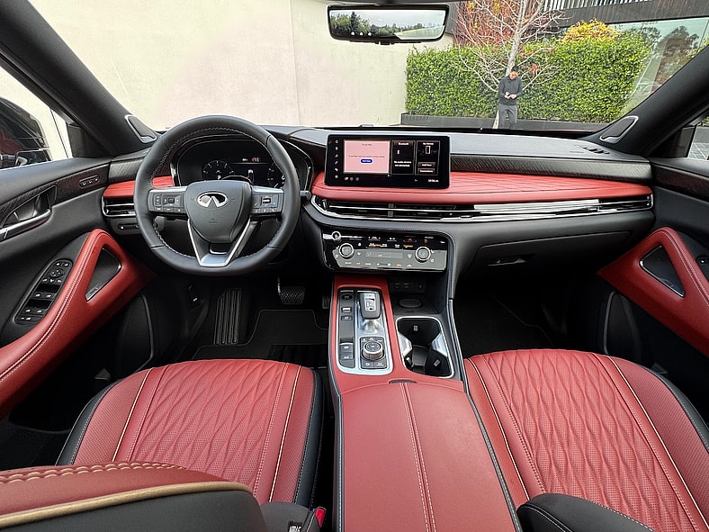 The First Ever Infiniti QX65 is Built To Spoil You. And It Just Might 7 The Front Cabin And Red Leather Seating In The 2027 Infiniti Qx65