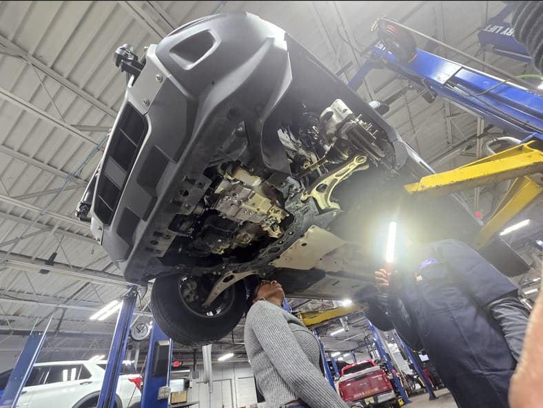 Checking The Underside To Look At Engine Seals, Brake Lines, And Fuel Lines