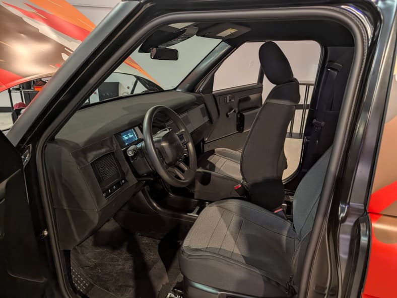 The Interior And Driver'S Seat Of The Slate Ev