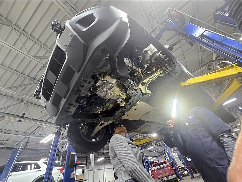 Checking The Underside To Look At Engine Seals, Brake Lines, And Fuel Lines