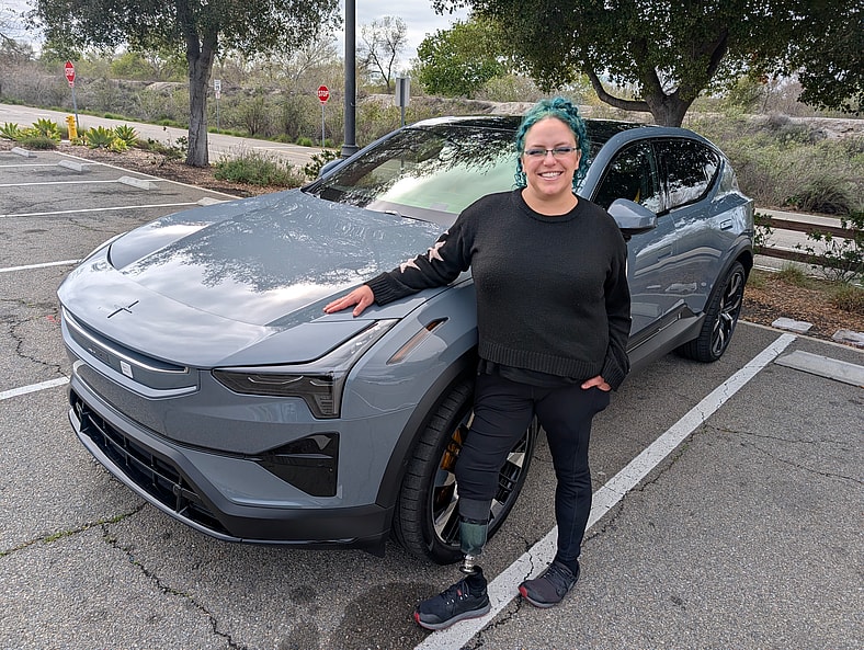 The 2025 Polestar 3 Breaks Some Traditional EV Rules, And Creates Magic With Every Drive 12 Liv Leigh Standing Next To A Polestar 3