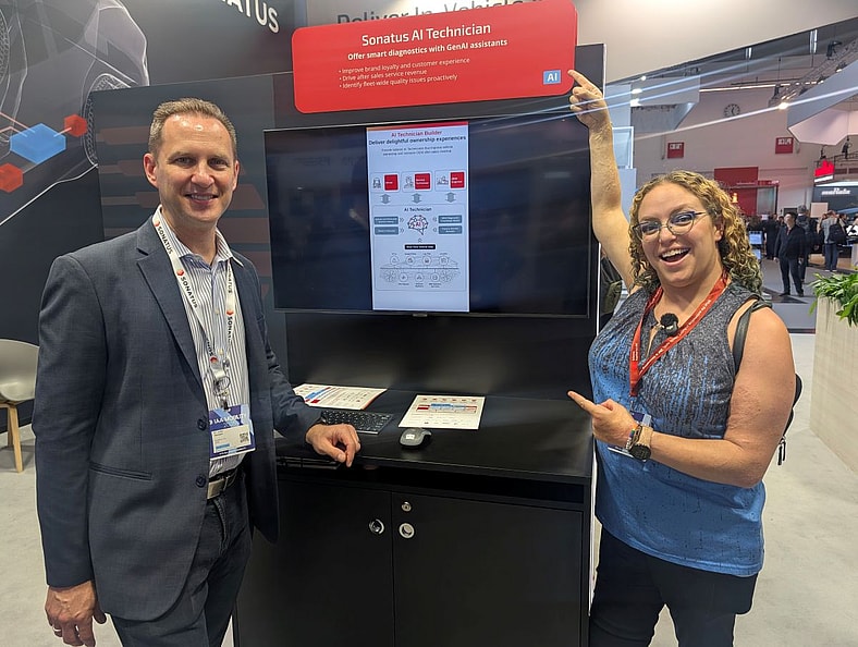 Liv Leigh Standing Next To The Ai Display