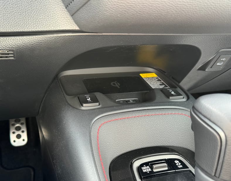 The 2025 Toyota GR Corolla DAT in Words, Pictures and Emotions 14 The Wireless Charger Is Tucked Under The Console And Holds A Phone Securely In The Toyota Gr Corolla Dat