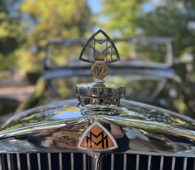 The Original Mercedes-Maybach Logo And Standing Hood Icon On A Classic Zeppelin Model