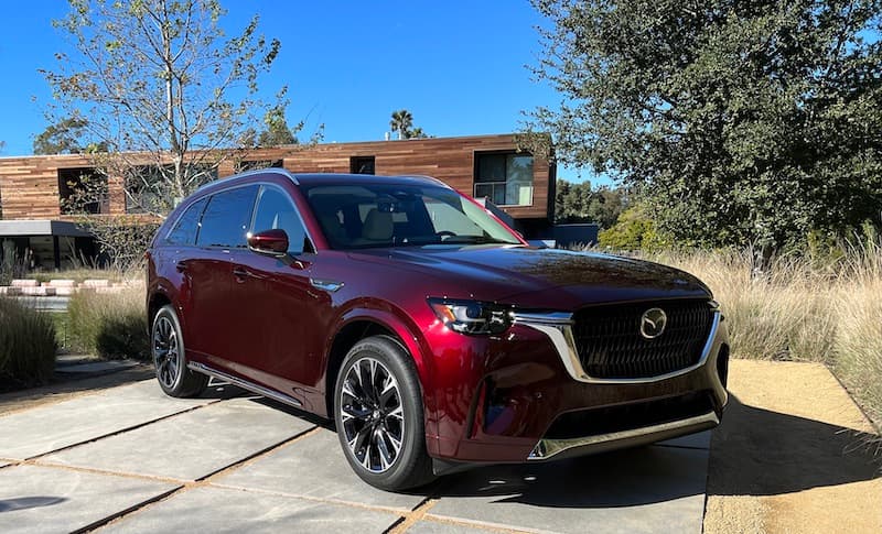 The Front Grille Of The Mazda Cx-90 Is Wide And Flat And Framed In Chrome