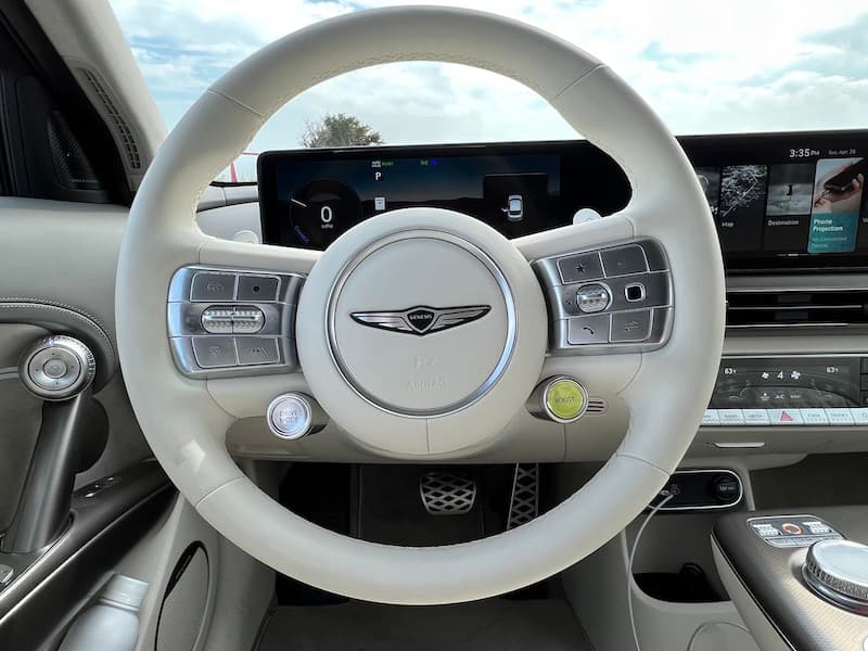 The Steering Wheel In The Genesis Gv60; The Yellow Button Activates Boost Mode