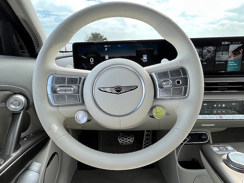 The Steering Wheel In The Genesis Gv60; The Yellow Button Activates Boost Mode