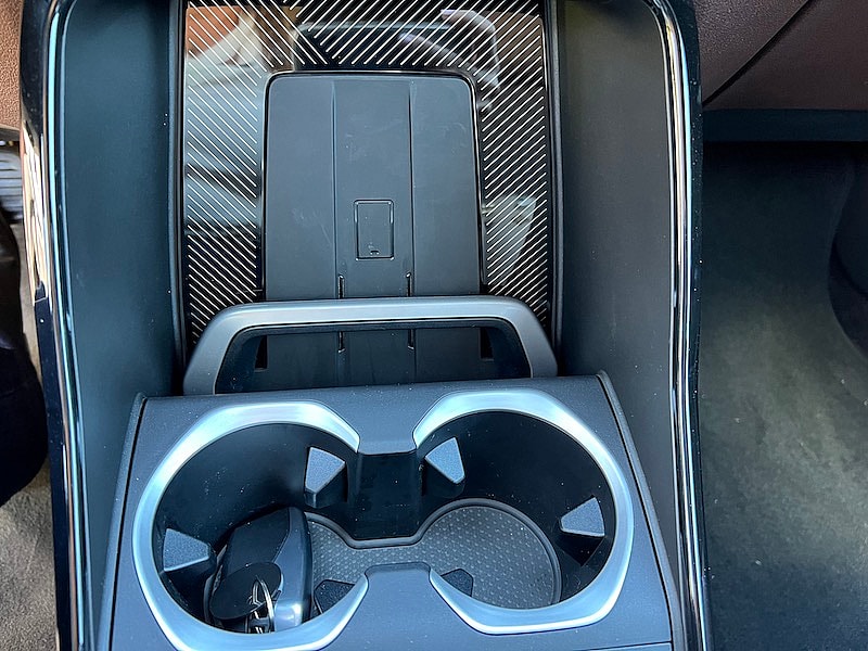 The Phone Charger Is A Vertical Pad With A Hold Bar