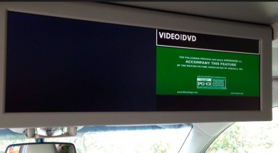 The pull down video screen can fit TWO movies on it at once