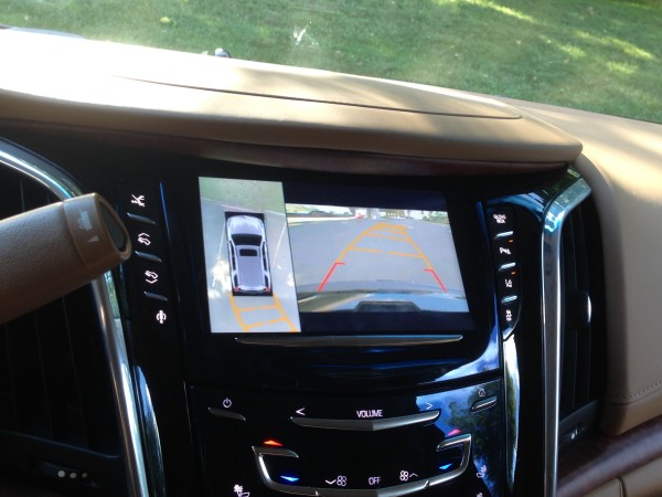 The rear view camera shows you what is around the car and also, on your trajectory path; touch pad on the right of the screen (top to bottom) disable the automatic running boards, adjust pedals inward, adjust pedals outward and turn off magnetic suspension control for a sportier ride. Touch buttons on the right side open the glove box, turn off park assist, lane keep assist and traction control. Notice the touch sensor controls below the screen, too; just a swipe of the finger sets volume, climate and more
