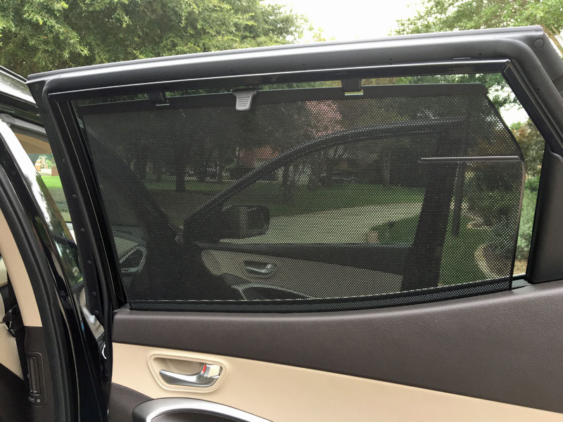 Sunshades keep back seat passengers cool in the Hyundai Santa Fe Sport 2.0T Ultimate. 