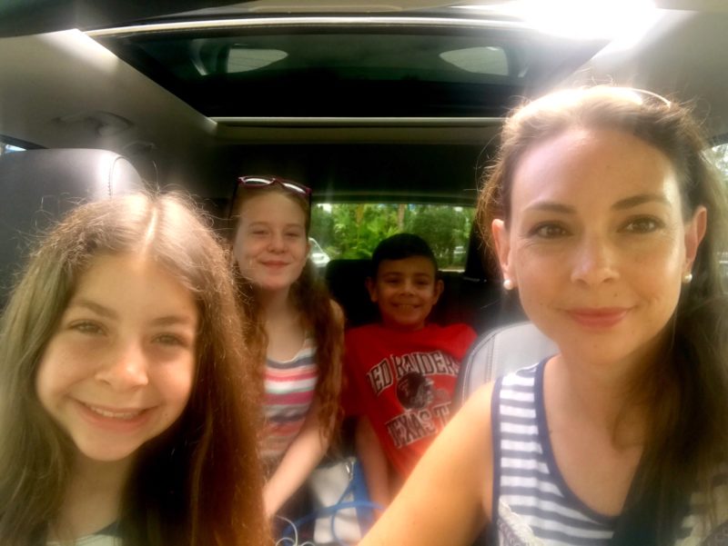 The kids and I driving around Orlando in a 2017 Ford Escape. 