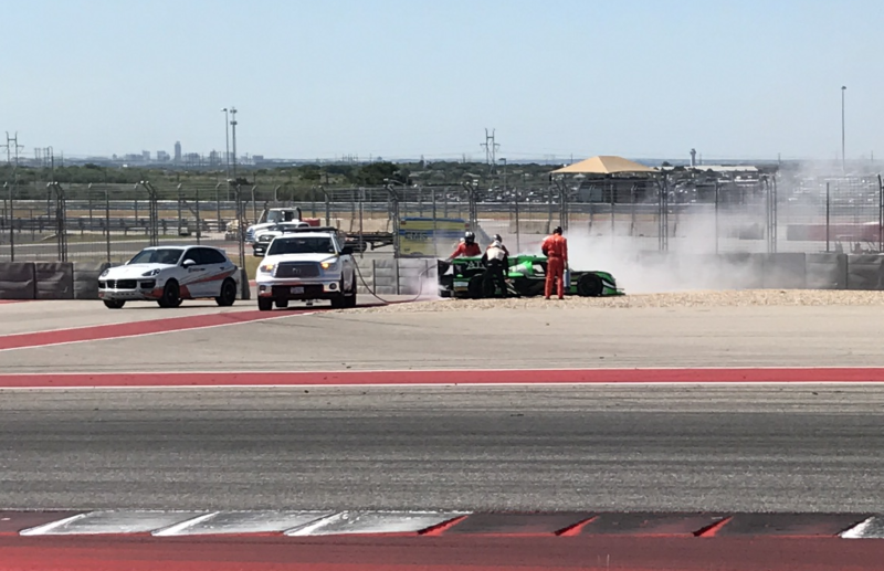 This Patron Tequila-sponsored car, driven by Ryan Dalziel, caught fire on the track and emergency vehicles arrived to help in a matter of seconds during the IMSA race. Photo: Kristin Shaw