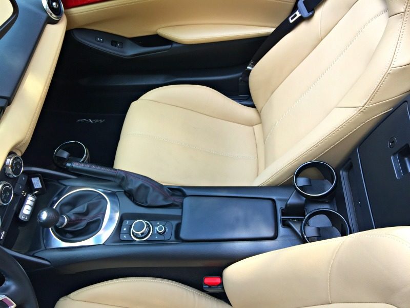 It's a tight fit inside the Mazda MX 5, a sports car for about $30,000.