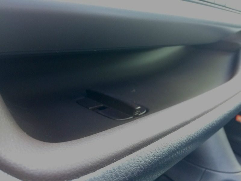 The Toyota Highlander Hybrid shelf has a stop to keep your phone from sliding away.