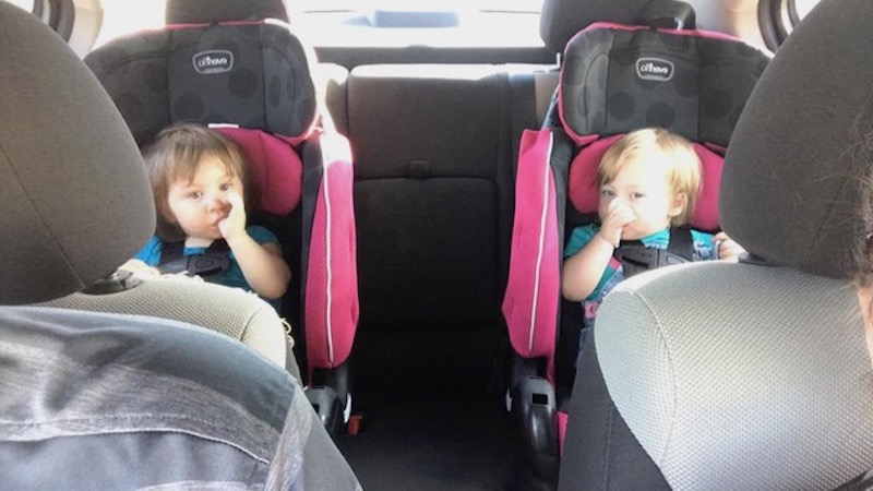 Our twins sitting in their car seats. But when should you replace child car seats after an accident?