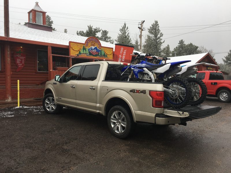 Hauling two dirt bikes with the tan 2018 Ford F-150 Diesel pickup truck