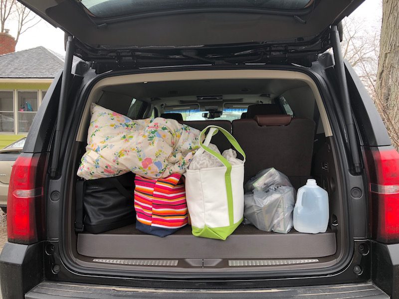 Loading up the Tahoe for travel. With the third row up there is limited space for suitcases and tote bags. Drop the third row and there is more than enough room.