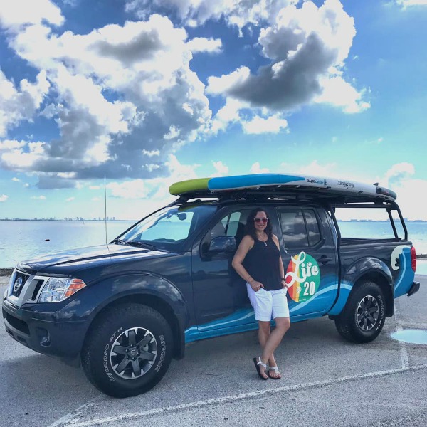 Nissan Frontier with paddleboard on top