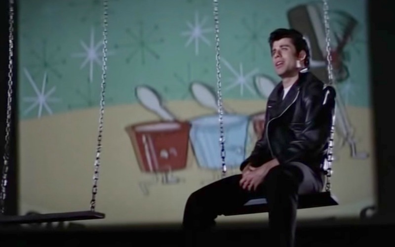 Danny singing Sandy at the drive-in movie theater in Grease on A Girls Guide to Cars