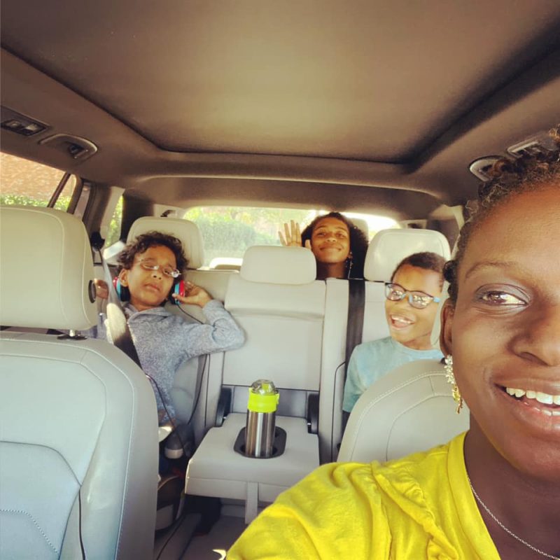 Selfie: Mom with three kids in car seats