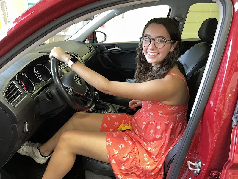One happy girl in her new car