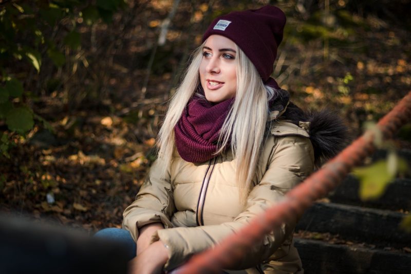 Girl looks on at autumn scenery