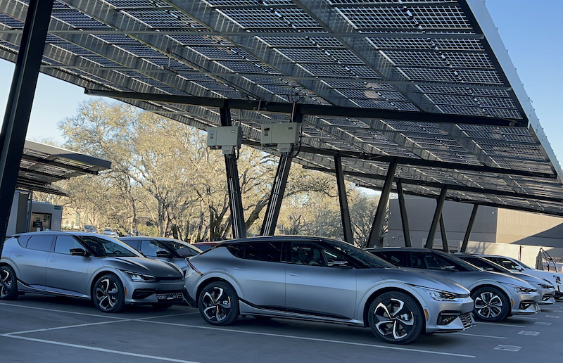 Kia EV6 test models charging up under solar panel covered parking