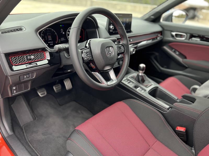 The driver's seat in the 2022 Honda Civic Si with the all important third pedal