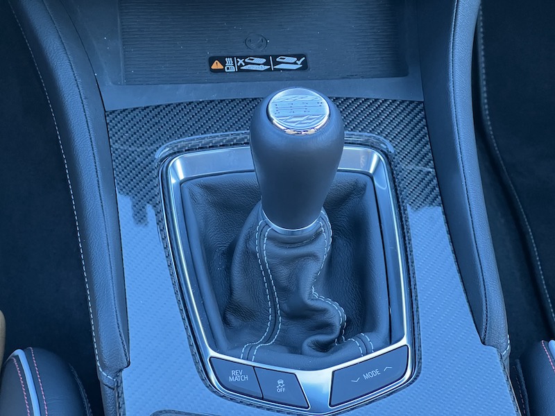 The manual shifter is topped with a carved metal shift pattern; it's an elegant touch, one I really loved
